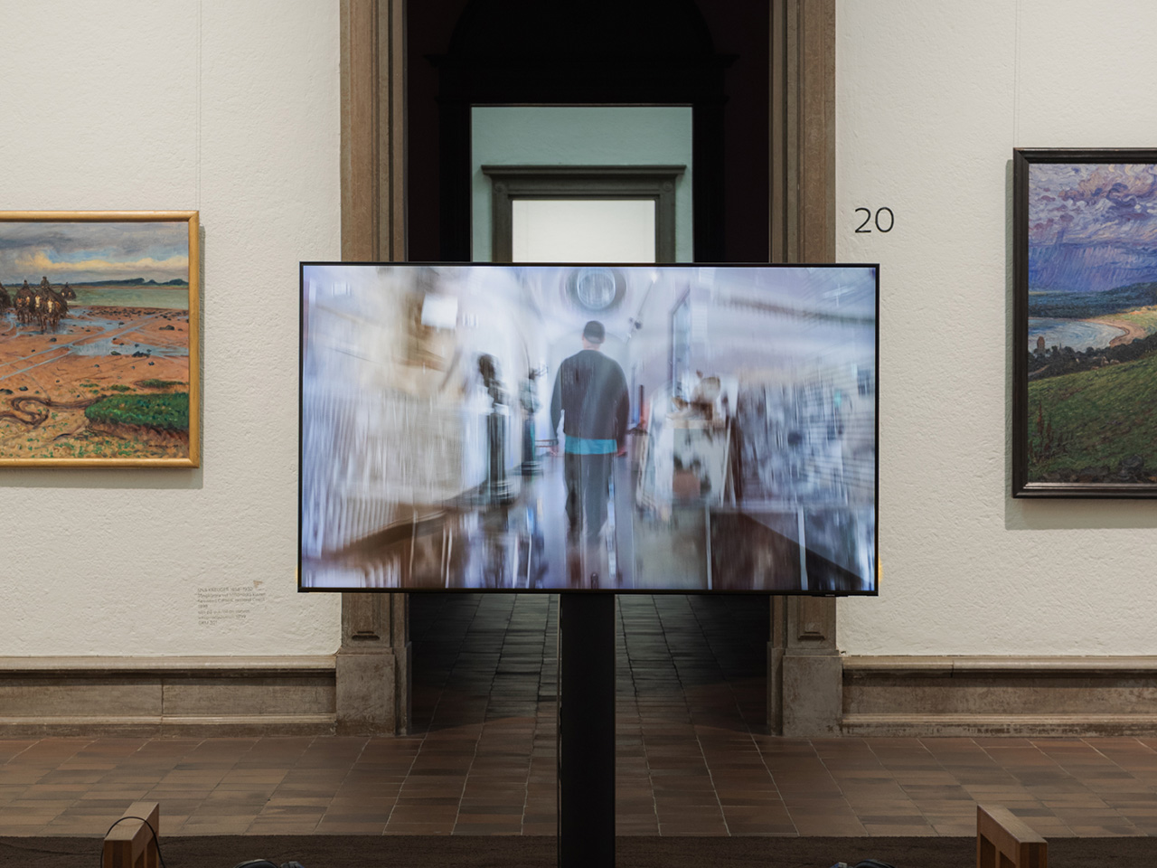 Video work displayed on screen in a museum