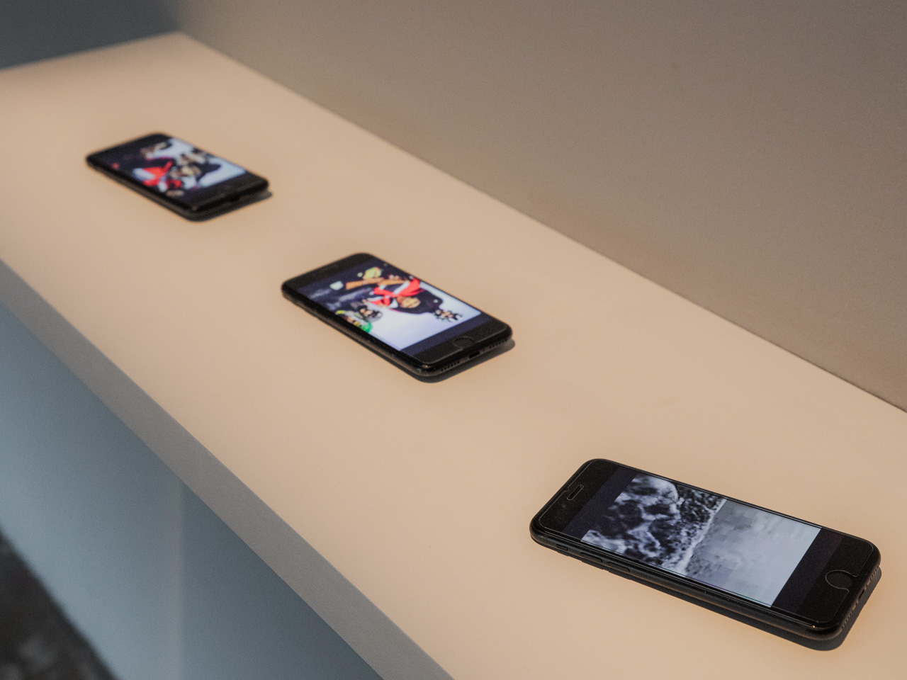 Video artwork displayed on three cell phones