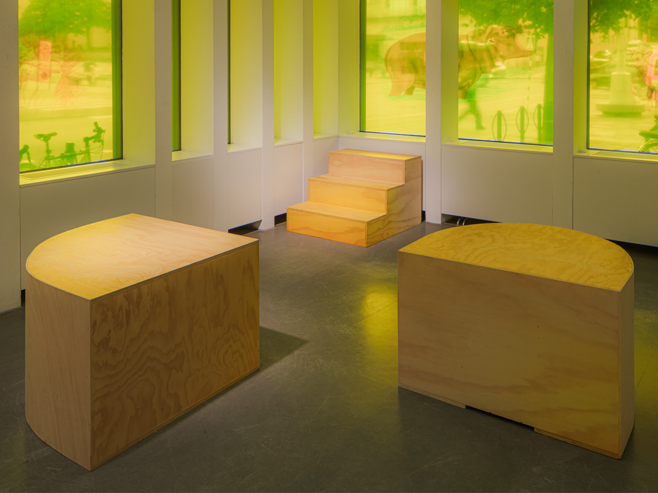 three podiums in different shapes standing on the floor